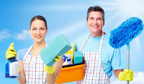 Cleaning staff reviewing safe handling procedures for products